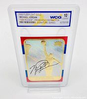 Front view of 1998 Fleer 23KT Gold Prism Holo Refractor Michael Jordan trading card showing holographic finish, Michael Jordan silhouette, facsimile signature, and grading label.
