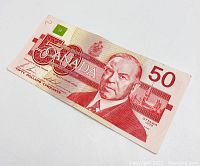 Front side of the 1988 Canadian $50 banknote showing the portrait of William Lyon Mackenzie King and signatures.
