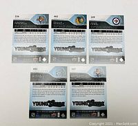 Back view of the same 5 2014-15 Upper Deck Young Guns rookie cards showing player statistics, card numbers, and team logos.