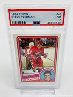 Front of PSA slab showing card image, label with year, player, card number, grade and certification number