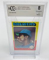 Front of 1975 Topps Mini Baseball Hank Aaron card graded BCCG 8, showing vibrant colors and player image.