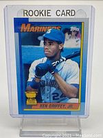 Front of 1990 Topps Ken Griffey Jr. baseball rookie card showing player image and team Mariners.