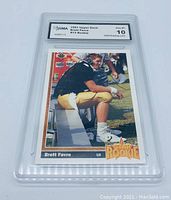 Front of the graded Brett Favre rookie card showing player on bench with 'Star Rookie' emblem, player name and grade label.