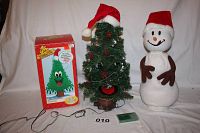Photo showing the Douglas fir talking tree with box, animated snowman, and accessories on a white background.