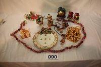 Full lot overview showing assorted figurines, beads, Fitz & Floyd plate, and decorative items