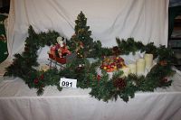 Wide shot of all items in the lot including Santa in sleigh, decorated tree, greenery, candles, and fruit decorations.
