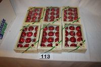Six unopened boxes of Pyramid brand red mercury glass Christmas ornaments arranged in two rows, each box containing 12 ornaments.