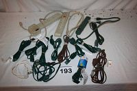 Photo of all power bars and multiple extension cords laid out on a white surface.