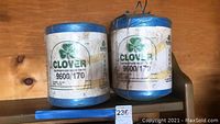 Two units of Clover polypropylene baler twine, blue color, showing labels with product details.