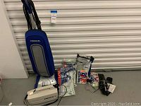 Full view of the upright vacuum, portable vacuum, auto vacuum with cords and replacement vacuum bags