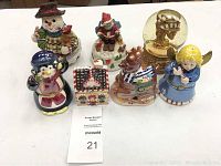 Full set of 6 Christmas music boxes displayed on a white surface