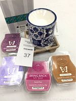 Photo of ceramic Indigo Tile wax warmer with blue floral tile design and packaging, including 4 wax bars in various colors.