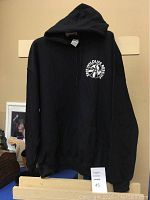 Full view of black Erie Wildlife Rescue hoodie showing front and logo position.