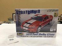Front view of the box showing the Revell 2010 Ford Shelby GT500 model kit branding and car image.