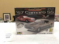 Box front showing Revell Special Edition '67 Camaro SS model kit with images of two car versions and Revell branding.