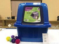 Blue enclosed cat litter pan with front flap door and label with cat image