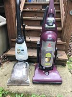 Dirt Devil shampooer and Bissell PowerClean Rewind vacuum side by side showing full units.