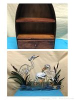 Photo showing the tabletop wooden shelf and the metal fishing heron wall art together.