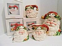 Full view of all ceramic Santa Claus items and their boxes, showing a figural large Santa head cookie jar, sugar bowl, creamer, and four mugs.