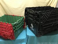 Photo showing three extra large black Monoflo storage containers stacked with interlocking lids.