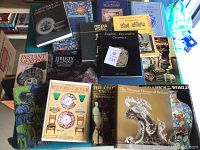 Photo showing a selection of books on ceramics, decorative arts, antiques, and restoration with varied colorful detailed covers.