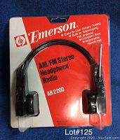 Original sealed blister pack of Emerson AM/FM Stereo Headphone Radio AR 2200 with model number and key features visible on package.