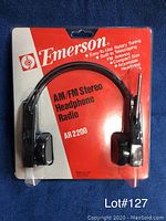 New in package Emerson AM/FM Stereo Headphone Radio AR 2200 with rotary tuning and built-in telescoping FM antenna