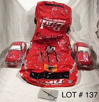 Image showing two red Mazda car-shaped pillows and one large red inflatable Budweiser racing car, all placed on a white backdrop.
