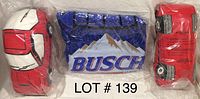 Two Mazda X-7 car pillows and one inflatable Busch car packaged, showing front and side details.