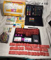 Overview of Crayola Super Stamper Kit contents and associated art supplies including crayons, colored pencils, markers, watercolor paints, and sidewalk chalk