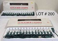 Two boxes containing 15-count flicker light strands each, unopened and in styrofoam trays, shown from front