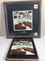 Framed print "Pinto" by Bev Doolittle displayed upright with matching book in front