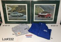 Photo showing two framed and matted Mazda car prints alongside two Mazda jackets in gray small and blue extra large, with a Mazda patch and name plate on display.