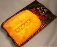 Top-down view of large rectangular ashtray with sailing ship relief and Mariner's Inn banner, showing interior basin with cigarette rests and glazed finish.