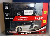 Front view of the XQ brand boxed twin pack containing Ford GT 500 Police Car and Audi R8 radio control cars.