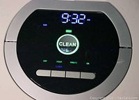 Close-up of the top control panel with digital time display and CLEAN button illuminated.