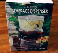 Box front showing image and product name of CreativeWare stacking beverage dispenser with 3-gallon capacity.