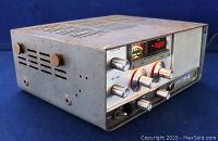 Front angled view of vintage Lafayette HA-460 six meter transceiver showing control knobs, power meter, and metal casing with ventilation slots.