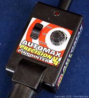 Close-up of the front panel showing controls and decals of the Automax Precision V4 pinpointer.