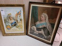 Overall shot of both framed prints: the Jubilee print and the black dress formal portrait print of Queen Victoria.