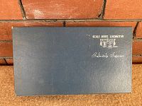 Blue cardboard box lid with United Scale Models branding and 'Infinitely Superior' text