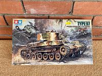 Full front view of vintage Tamiya Type 97 Japanese Medium Tank model kit box showing detailed painted tank art in WWII setting.