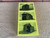 Top panel of the kit box showing three black and white photos of the completed Branchline Bucket Coaling Station model from different angles.