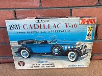 Front of the unopened blue box featuring artwork of the 1931 Cadillac V-16 Sport Phaeton model with the vehicle in blue and black, Jo-Han logo in upper right corner, indication this is a 1/25 scale plastic assembly kit with over 160 parts and steerable wheels.
