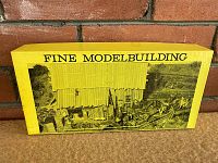 Yellow box lid front with 'FINE MODELBUILDING' printed and photo illustration