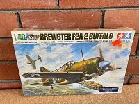 Photo of the front of the sealed Tamiya Brewster F2A-2 Buffalo model kit box showing colorful aircraft illustration and scale details.