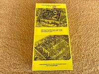 Promotional sheet front showing two overhead layout renderings and title text