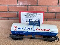 Side view of Jack Frost Sugar Company 10,000 gallon tank car model with box behind.