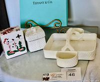 Photo of Tiffany & Co. serving tray, two trinket boxes, Tiffany box, and metal display stand on a surface.