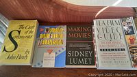 Top view showing covers of four books about filmmaking and screenwriting about movies and TV.